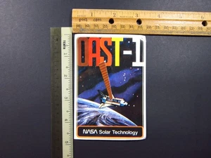 NASA OAST-1 Pegatina Tecnología Solar Satélite Transbordador Espacial Misión De Colección Original - Imagen 1 de 2