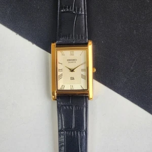 vintage Seiko Slim Tank Quartz Men Golden Dial Black Strap Dress Watch UK29 - Picture 1 of 7