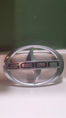 Scion XB Toyota BB Hatch Liftgate Used Emblem (1) One NCP30 NCP35 Silver Grey - Image 1 of 2
