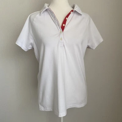 Camiseta polo mediana para mujer IZOD Performx ropa deportiva golf tenis blanca con rojo Foto 1 de 4