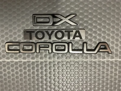 Toyota Corolla DX 1988-1989-1990-1992 emblema maletero trasero OEM Foto 1 de 4