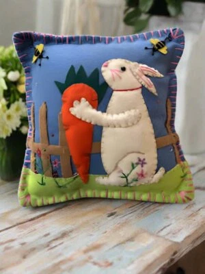 Primitive Farmhouse Felt Spring Easter Bunny With Carrot 8" x 8" Pillow - Image 1 of 3