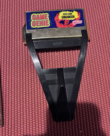 NES Game Genie and Book