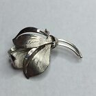 Stainless steel silver tone floral brooch and pendant