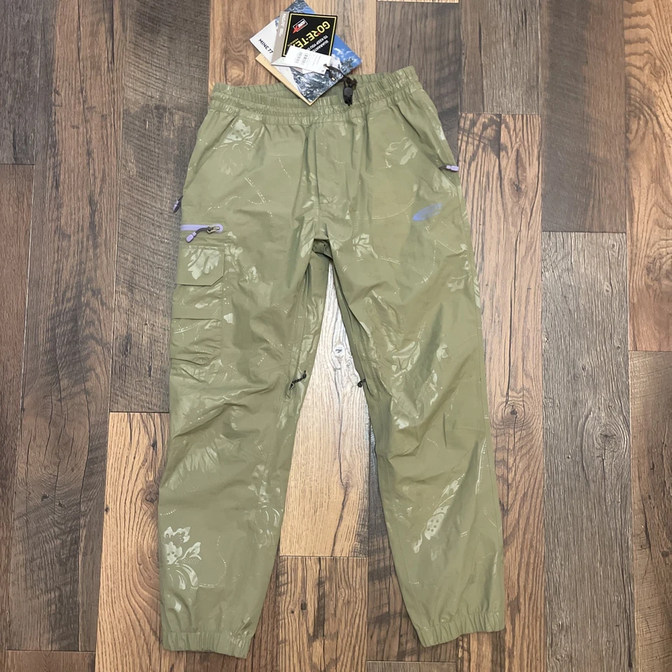 Pan de lluvia Mine 77 Gore-Tex Paclite unisex mediano, verde encubierto Foto 1 de 4