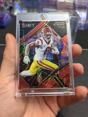 2023 Panini Select Draft Picks #156 Amon-Ra St. Brown Red Lazer Prizm - Image 1 of 4