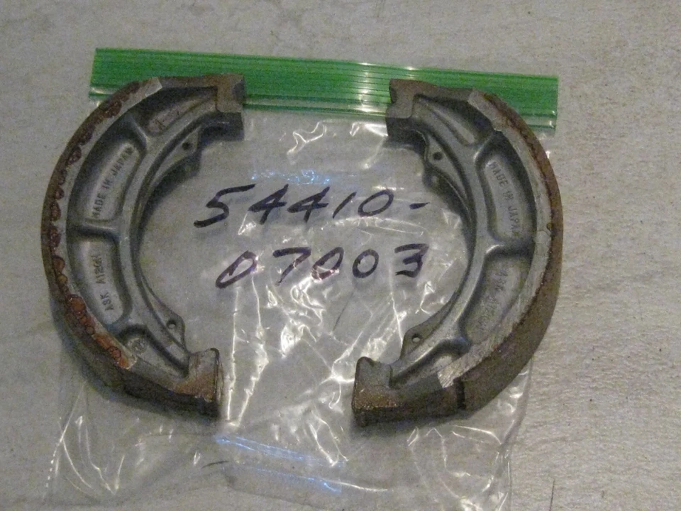 SUZUKI T125/TS/TM/TC/SP/RS/RM/RL/GT/GN/DS/DR/A/AC BRAKE SHOES NOS! - Image 1 of 1