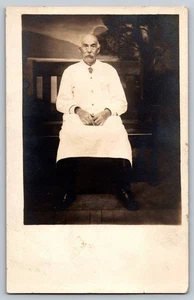Montreal Man in White Coat – Butcher, Chef, or Medical Uniform – Studio Portrait - Picture 1 of 2