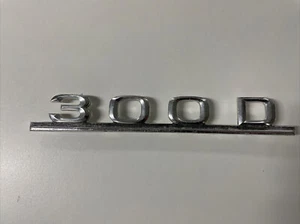 Mercedes Benz KOFFERRAUMABZEICHEN 300 D 1238170915 - Bild 1 von 7