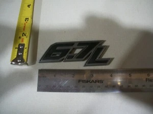 FORD 6,7 L PLATA CROMO EMBLEMA OEM USADO - Imagen 1 de 1