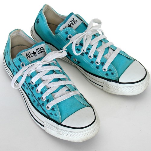 Teal and blue Converse All Star Chuck Taylor women’s shoes with white laces and white rubber soles.