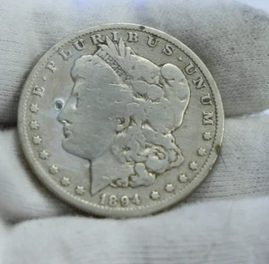 1894 O US Morgan Silver $1 VG Cleaned (Partial Hole) - Picture 1 of 2