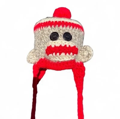 Hecho a mano bebé tejido ganchillo calcetín mono gorro sombrero orejeras borlas pom tobogán Foto 1 de 4