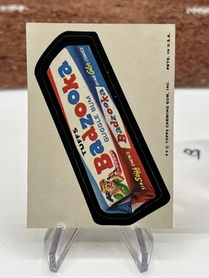 Vintage 1974 Topps Wacky Package Tuffs Badzooka Guggle Bum Sticker Card (B) - Image 1 of 2