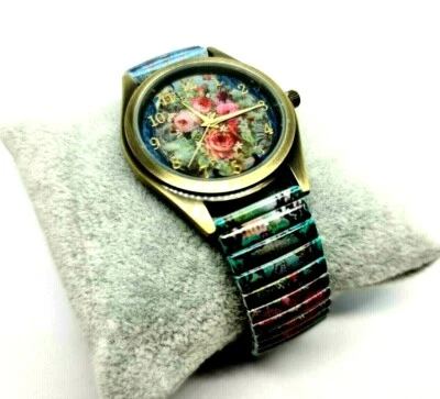 Reloj de cuarzo de Michal Negrin correa elástica de metal con tonos de flores azules. Foto 1 de 4