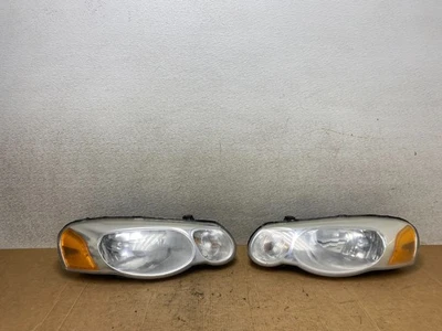 2004 2005 2006 Chrysler Sebring Left+Right Side Headlights T3370 DW - Image 1 of 4