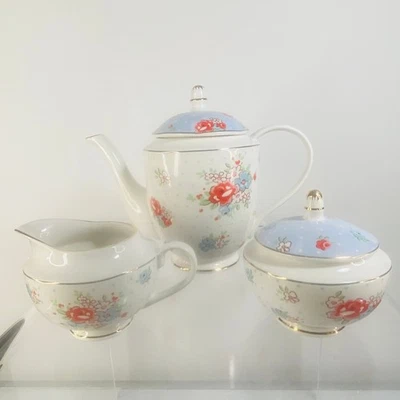 Tetera Grace Teaware Porcelana FLORES BRILLANTES Azúcar y Crema Borde Azul/Dorado Foto 1 de 4