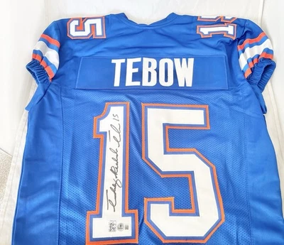 UF FLORIDA GATORS TIM TEBOW signed FULL NAME GAME CUT JERSEY HEISMAN BECKETT 15 - Image 1 of 4
