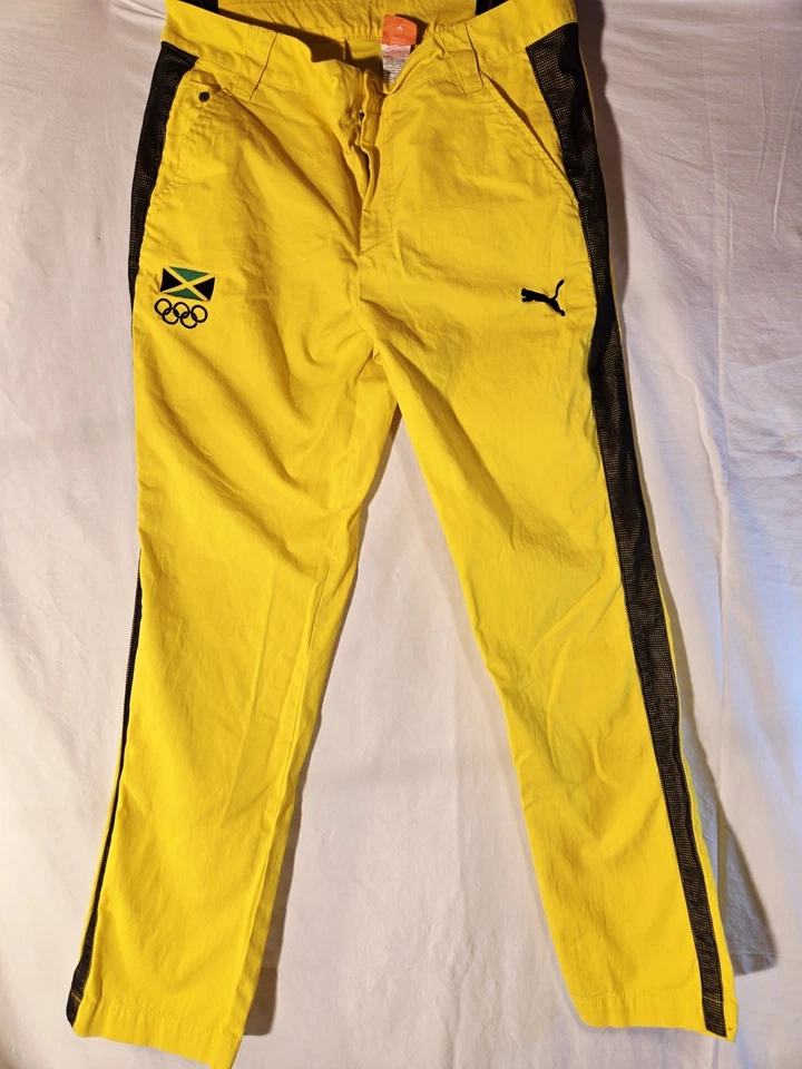 Pantalones deportivos olímpicos PUMA Jamaica talla L bolsillos de malla amarilla Foto 1 de 4