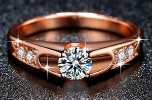 Rose Gold band with a framed Cubic Zirconia Center, finished double zirconia