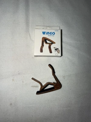 CM386* - WINGO JX-09U UKULELE CAPO IN ROSEWOOD COLOR - NEW IN BOX - Image 1 of 3