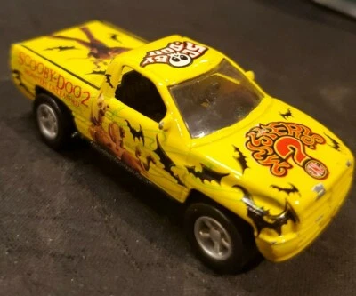 RACING CHAMPIONS 96 DODGE RAM, SCOOBY DOO 2, YELLOW 1:64 SCALE - Image 1 of 4