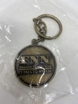 Llavero de latón vintage FNN Financial News Network "It Pays To Watch" Foto 1 de 3