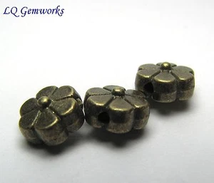 60 ANTIQUE BRASS TONE Base Metal 7mm Flower Beads #416 - Picture 1 of 1
