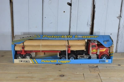 VINTAGE ERTL PETERBILT LOGGER SEMI LOG TRAILER GREAT NORTHWEST TIMBER CO BOX - Image 1 of 4