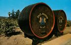 Paul Masson. Old oak barrels in parking lot, Saratoga, California, USA (1980s)