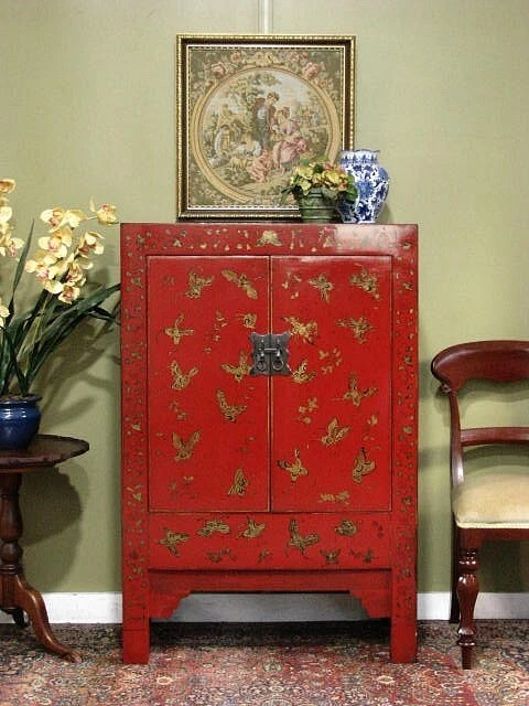 ORIENTAL RED PAINTED 2 DOOR STORAGE CABINET WITH GILT BUTTERFLY DECORATION. - image 1 of 4