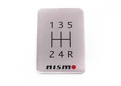 New Genuine Nissan Nismo 5Spd Shift Pattern Emblem 370Z (2009 - 2020) 96935RN000 - Image 1 of 4