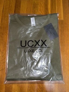 UCXX T Shirt Neu Und Versiegelt - Bild 1 von 1