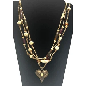 Handmade Beaded Twine Necklace with a Metallic Pendant - Picture 1 of 4