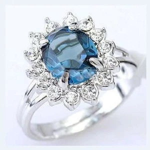 ANILLO DE ORO BLANCO 18 KT  CHAPADO CON TOPACIO AZUL Y CIRCONIOS  BLANCOS - Imagen 1 de 1