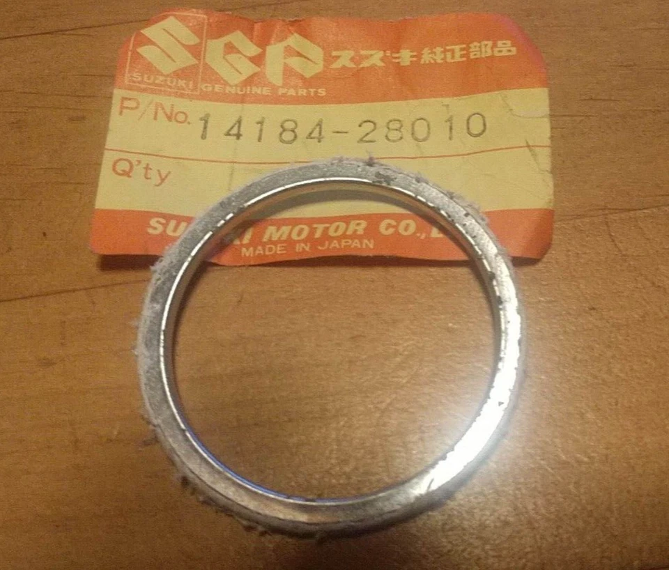 Junta de tubo de escape Suzuki 78-80 DS185 76 RM100 75 RM175 14184-28010 #L3 NUEVO DE STOCK Foto 1 de 1