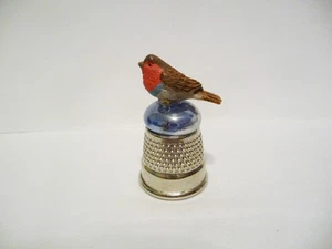 THIMBLE SILVER TONE W/A BIRD TOPPER ON A BLUE BEAD - Picture 1 of 5