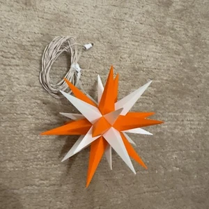 1 Bastelstern LED 13cm A1b/A1e aus Herrnhuter Adventskalender 2023 Orange & Weiß - Bild 1 von 2