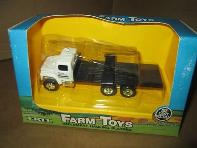 Camión de suministros agrícolas vintage Ertl 1:64 IH International 10 ruedas plataforma 1987 con caja Foto 1 de 4