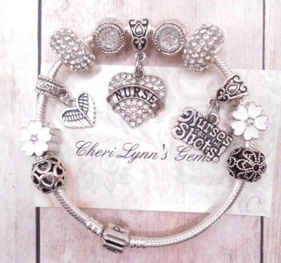 STERLING SILVER PANDORA CHARM BRACELET WITH WHITE CZ NURSE HEART EUROPEAN CHARMS - Image 1 of 4