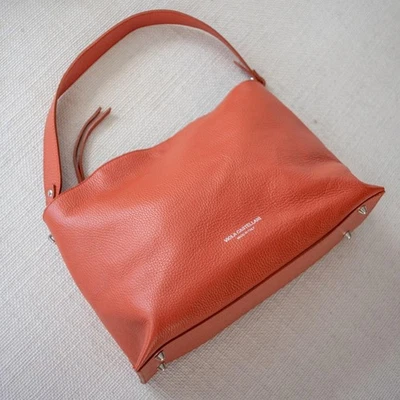 Bolso de hombro estilo hobo de cuero naranja italiano europeo Foto 1 de 4