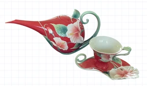Tetera y taza de té de hibisco Franz Porcelain Island Beauty con platillo rojo usado en excelente estado - Imagen 1 de 20
