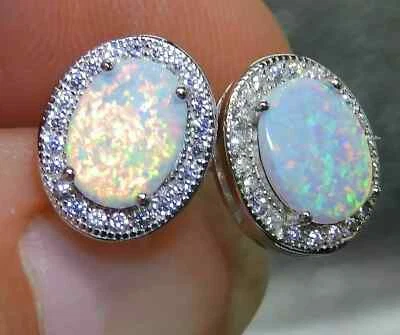 14k White Gold Plated Women's 2Ct Oval Cut Simulated Fire Opal Halo Stud Earring - Image 1 of 4