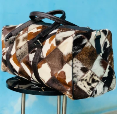 Bolso de lona de cuero natural con pelo de vaca | Bolsa de viaje para hombre y mujer Foto 1 de 4