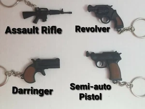  Miniatur Spielzeug verschiedene Schusswaffen Schlüsselanhänger, Neuheit, Sammlerstücke - Bild 1 von 9