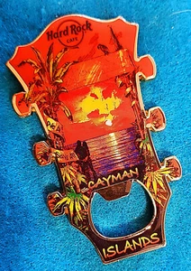 CAYMAN ISLANDS FLASCHENÖFFNER GITARRENKOPF LIEBHABER SONNENUNTERGANG MAGNET Hard Rock Cafe - Bild 1 von 1