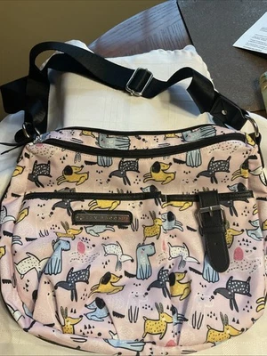 Cartera de mano forrada rosa con patas de resorte de nailon Lily Bloom Foto 1 de 4