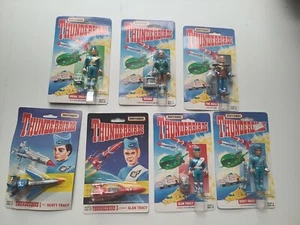 Thunderbirds Konvolut 8 Figuren & Fahrzeuge (Alan Scott, John Virgil, Brains, Hood) - Bild 1 von 9