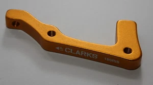 Adaptador de disco Clarks / adaptador de disco de freno naranja / rueda delantera dorada para 180 mm IS - Imagen 1 de 1