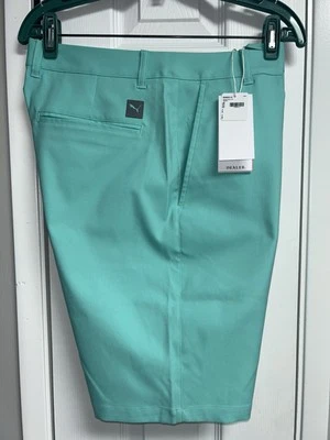 NUEVO CON ETIQUETAS PUMA DEALER 10 PANTALONES CORTOS ELÁSTICOS DE GOLF PARA HOMBRE 32 UPF 50+ VERDE ESPUMA DE MAR Foto 1 de 4